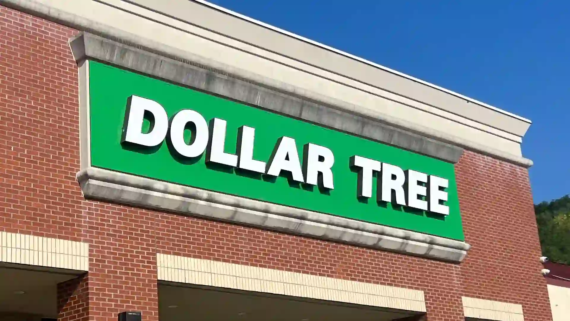 Dollar Tree Store green sign on a brick building stock photo