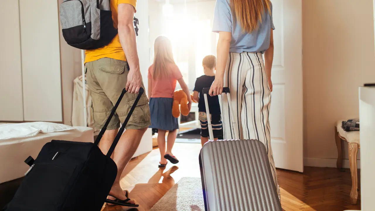 Shot of a happy family leaving their home for a vacation.