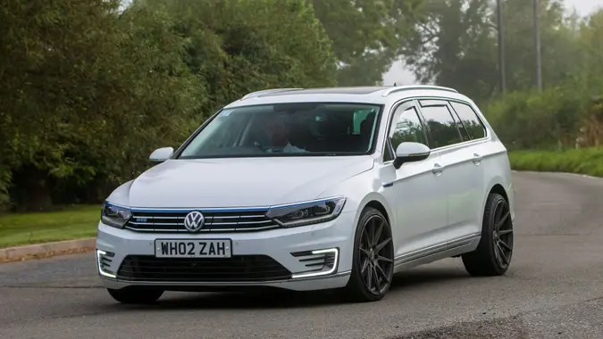 Whittlebury,Northants,UK -Aug 26th 2023: 2017 white Volkswagen Passat estate car travelling on an English country road.
