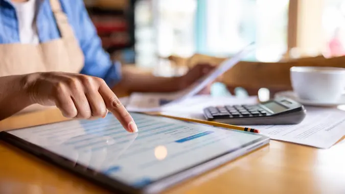 Business owner doing the accountancy at a cafe stock photo