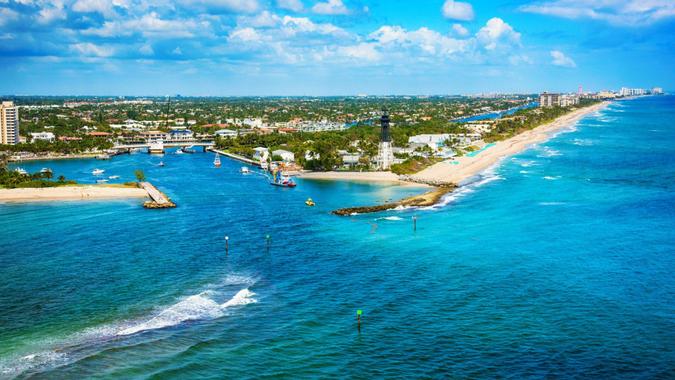 The Hillsboro Inlet separating the city of Pompano Beach to the south and Lighthouse Point community of Deerfield Beach to the north shot during a helicopter photo flight from an altitude of about 200 feet over the Atlantic Ocean.