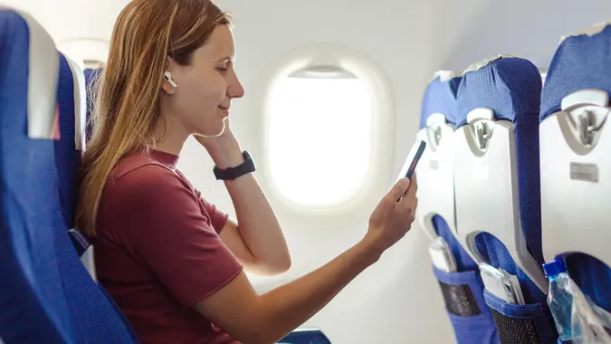 Woman in the airplane stock photo