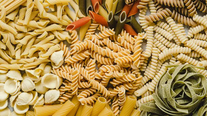 Table top view of variety of uncooked pasta.