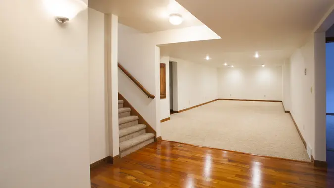 Spacious Finished Basement with Carpet and Hardwood Floors stock photo