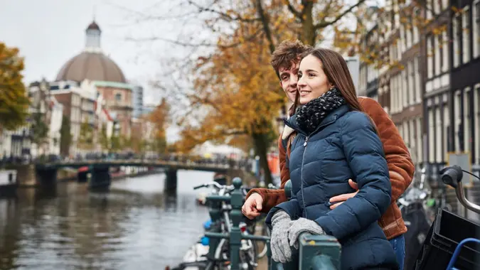 Shot of an affectionate couple exploring a foreign city during the day.
