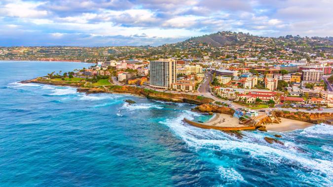 Aerial view of the coastal community of La Jolla, California approximately 10 miles north of downtown San Diego shot via helicopter from an altitude of about 300 feet over the Pacific Ocean.