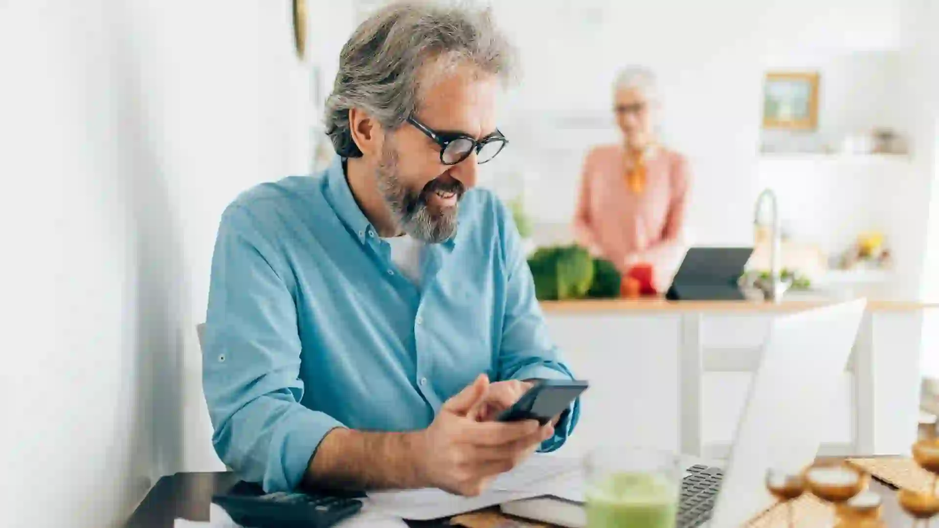 Senior man calculating bills stock photo