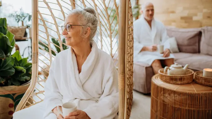 Two seniors or a senior couple having a spa day or participating in a wellness retreat.