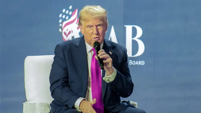 Former United States President Donald J Trump, the 2024 Republican Party nominee for President of the US, is joined on stage by his pastor Paula Michelle White-Cain while making remarks to the National Faith Advisory Summit at the Worship With Wonders Church in Marietta, Georgia.
