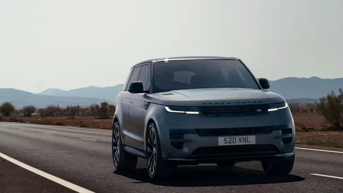 2024 or 2025 Land Rover Range Rover Sport driving on the road for stock photo.