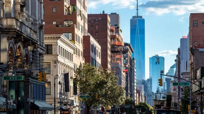 View of the historic buildings along 6th Avenue towards downtown Manhattan in New York City NYC.