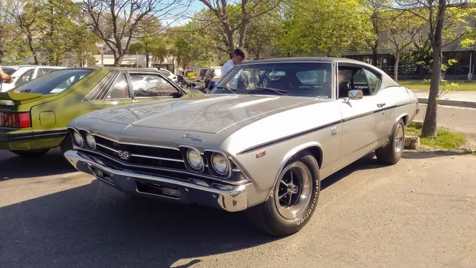 Buenos Aires, Argentina - Sept 29, 2024: Old silver gray shiny 1969 Chevrolet Chevelle SS 396 sport coupe at a classic car show in a parking lot.