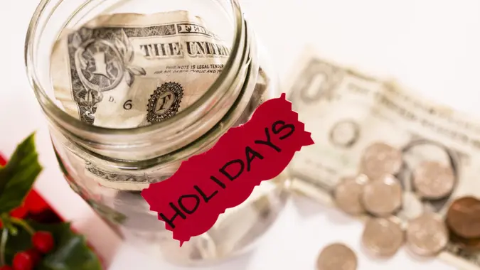 Glass canning jar serves as a "savings bank" for the Christmas Holidays.