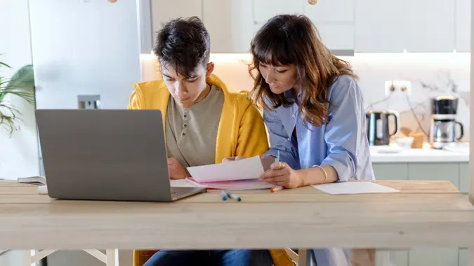 Mother and son studying together stock photo