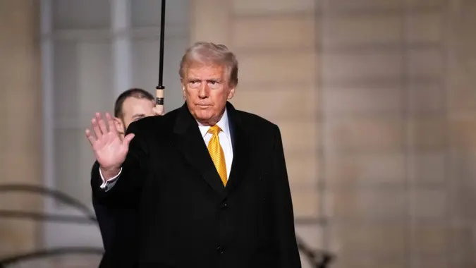US president-elect Donald Trump leaves after a meeting at The Elysee Presidential Palace in Paris on December 7, 2024.