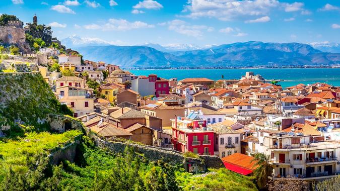 Nafplio or Nafplion, Greece, Peloponnese old town houses aerial panorama and snow mountains banner.