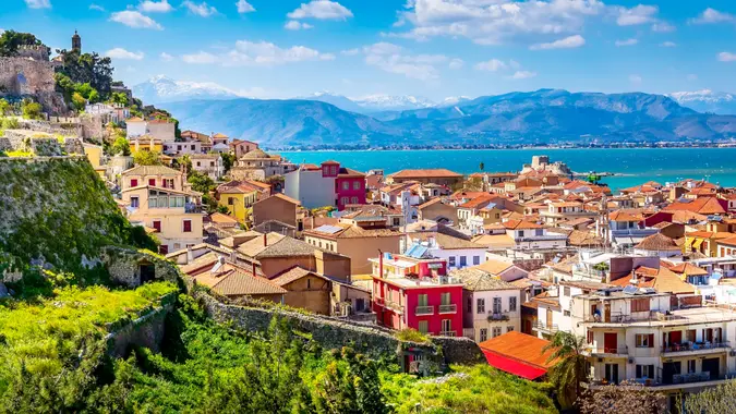 Nafplio or Nafplion, Greece, Peloponnese old town houses aerial panorama and snow mountains banner.