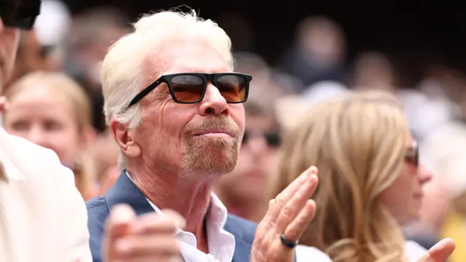 Sir Richard Branson sits in the crowd during the match with Carlos Alcaraz (ESP) vs Mark Lajal (EST); All England Lawn Tennis and Croquet Club, London, England; Wimbledon Tennis Tournament, Day 1.