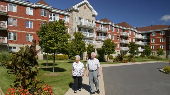 Senior couple outdoors walking stock photo