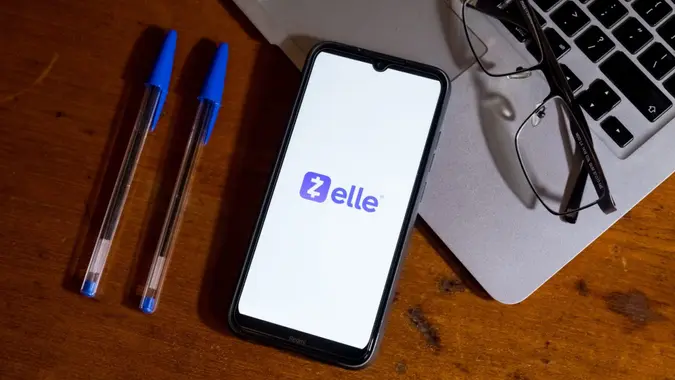 The Zelle logo is displayed on a smartphone screen in Athens, Greece, on February 22, 2024.
