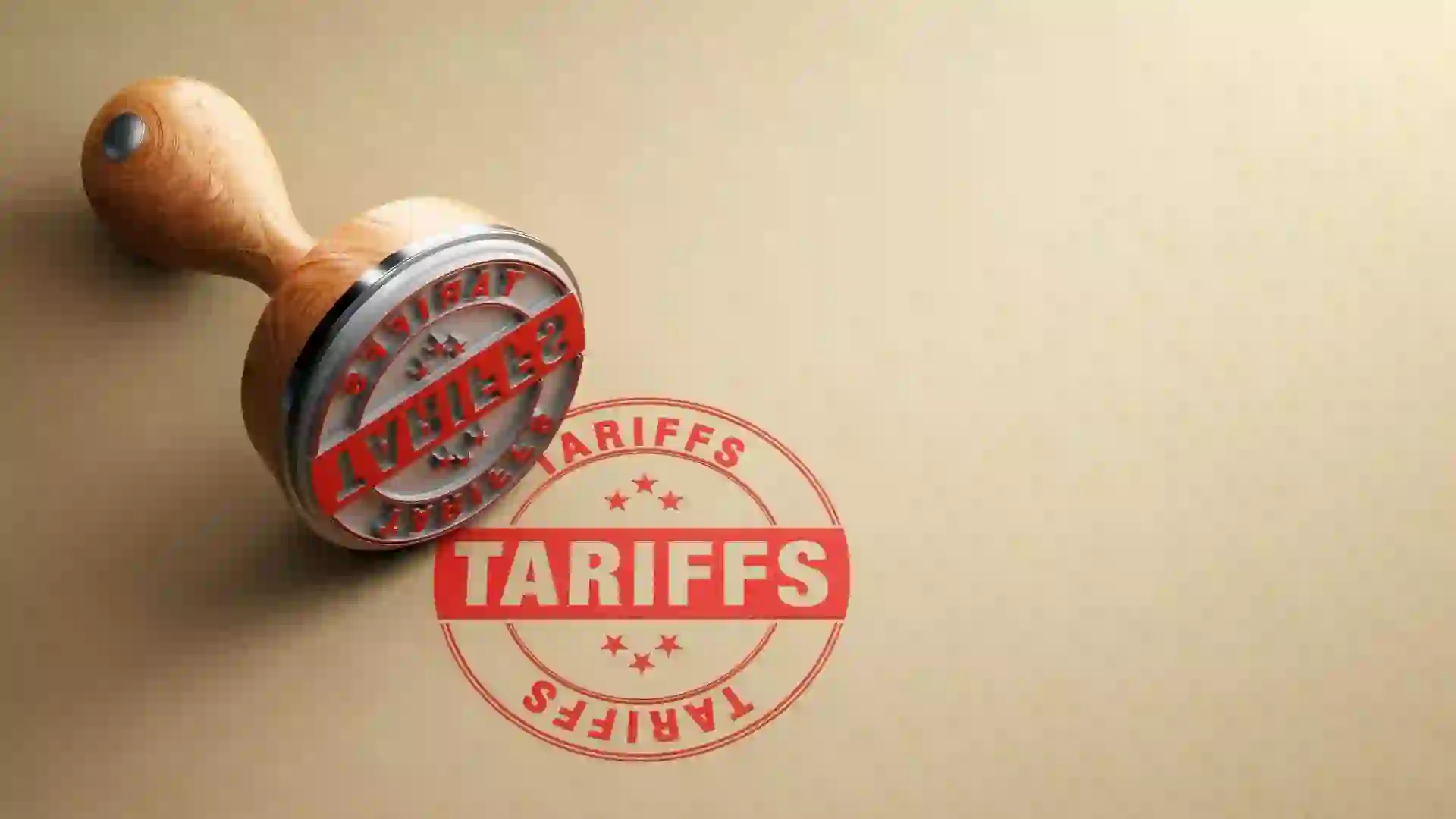 Wooden tariffs stamp is sitting on recycled paper background.