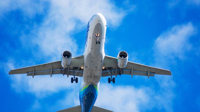 Alaska Airlines Airbus a320 aircraft with deployed landing gear preparing for landing at SJC airport - San Jose, California, USA - 2020.