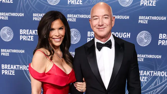 SANTA MONICA, LOS ANGELES, CALIFORNIA, USA - APRIL 05: Lauren Sanchez and fiance/American entrepreneur, business magnate, Founder and Executive chairman of Amazon Jeff Bezos arrive at the 11th Annual Breakthrough Prize Ceremony 2025 held at the Barker Hangar on April 5, 2025 in Santa Monica, Los Angeles, California, United States.