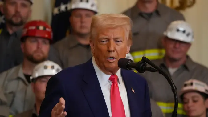 President DONALD TRUMP signed a series of executive orders to allow for more coal plants today in the White House, surrounded by a number of coal miners.