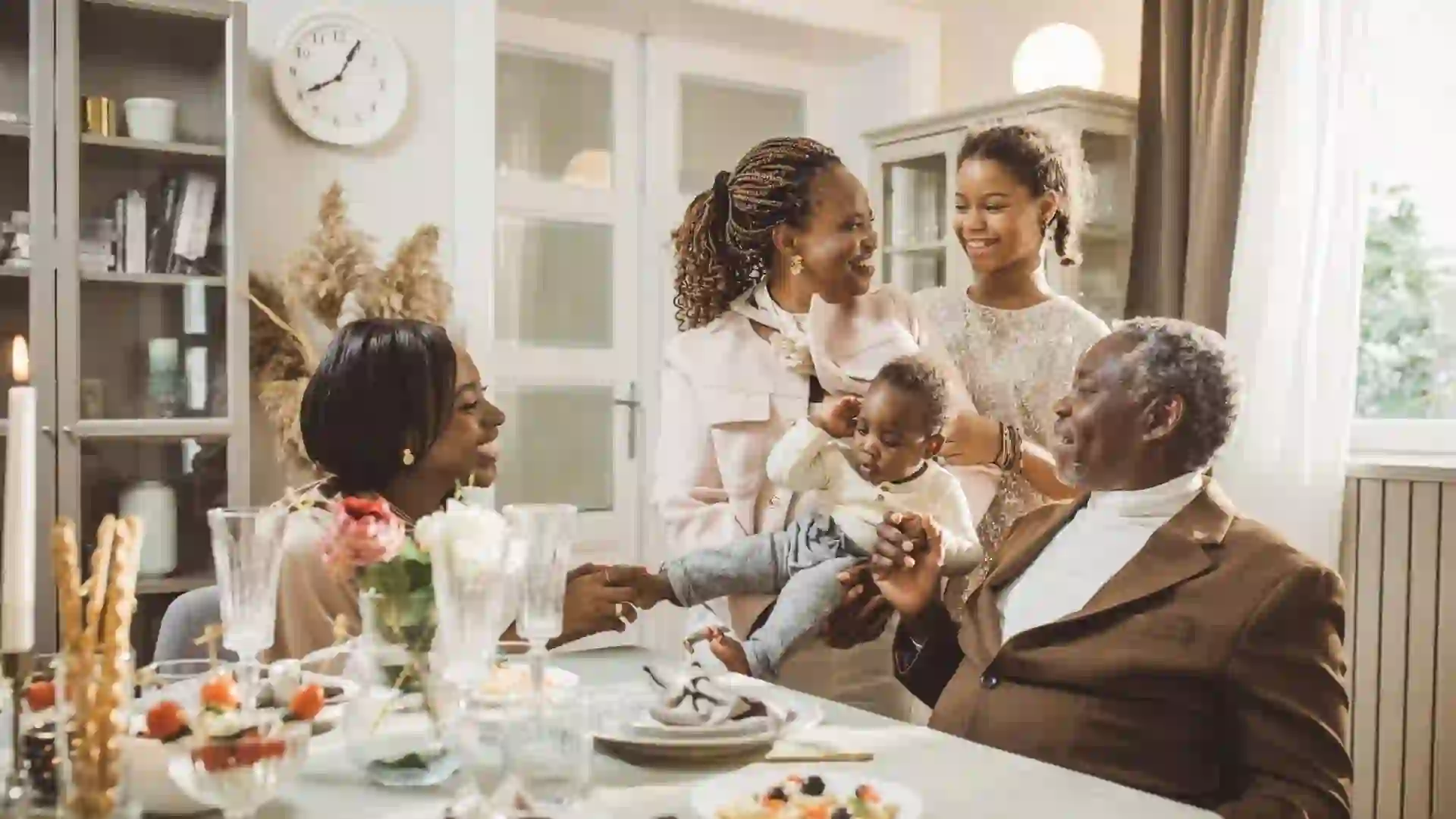 Happy extended family talking during dinner.
