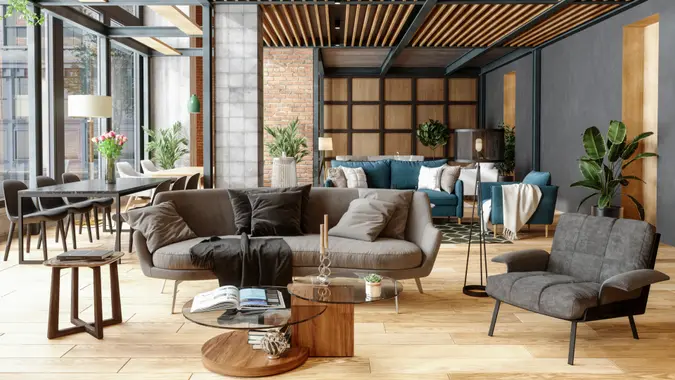 Furniture Showroom With Plants, Spotlights And Brick Wall.