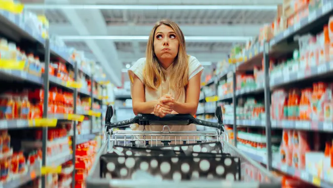 Confused Client Thinking What to Buy in a Supermarket stock photo