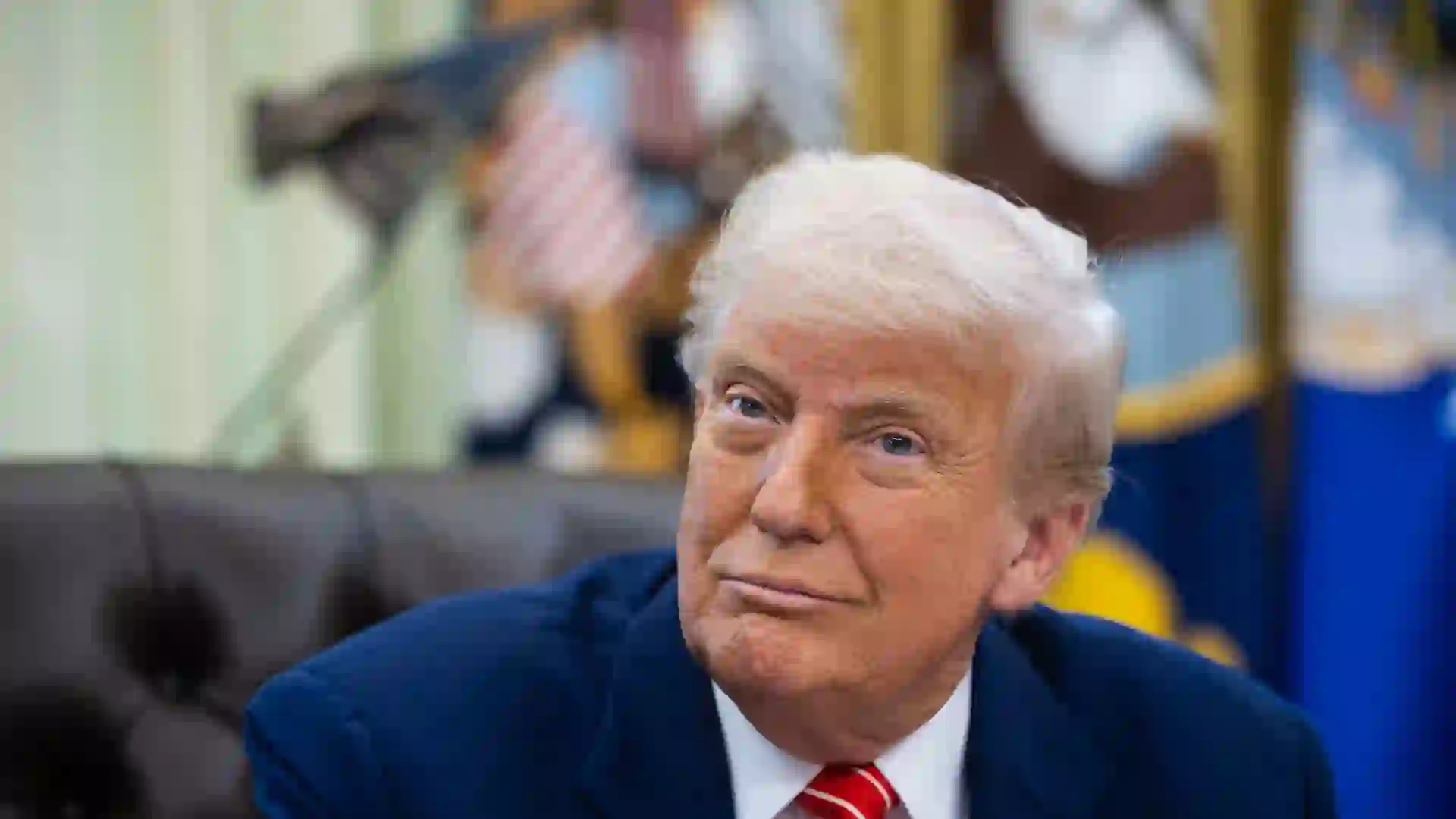 President Donald Trump sitting in his office at the White House.