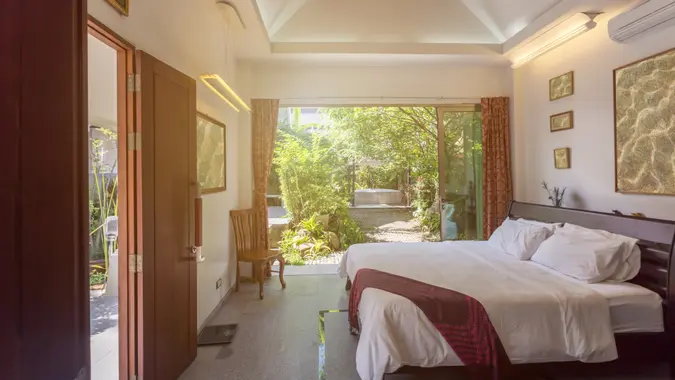 Luxury villa bed room interior. Open space, garden terrace