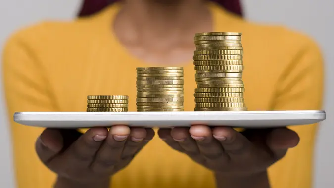 Woman with tablet proposing to earn money in the Internrt stock photo