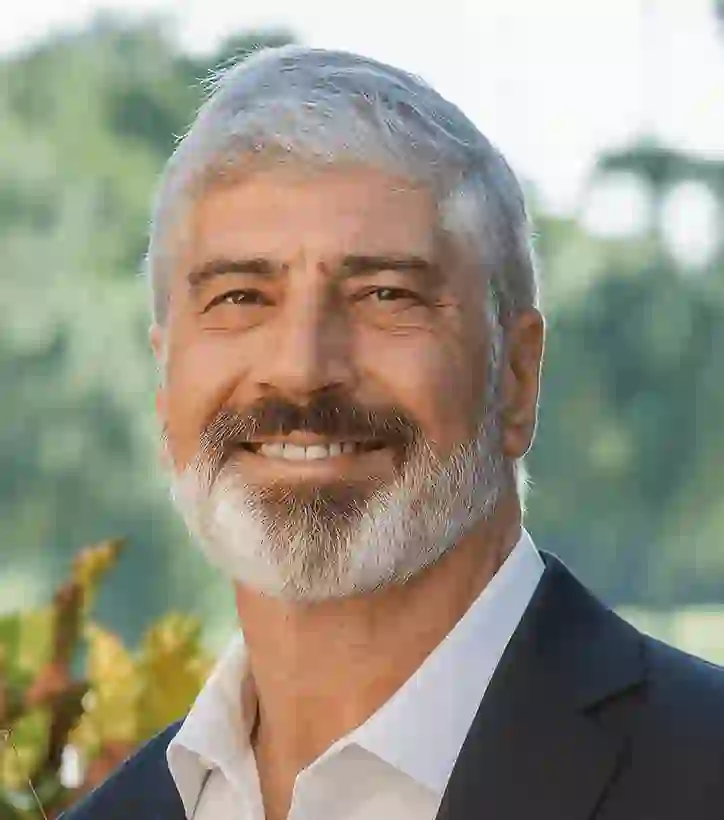 Adam B. Frankel, a freelance writer, featured in a professional headshot with a neutral background.