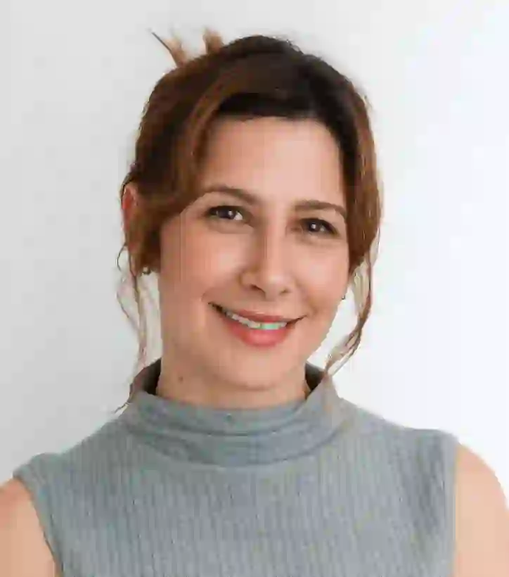 Freelance writer Sarah Silbert's professional headshot, featuring a polished look and neutral background.