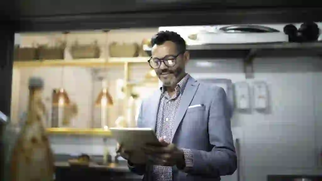 Businessman/owner checking kitchen supplies.