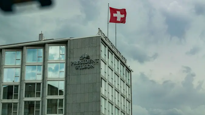 A shot of the President Wilson Hotel in Geneva, Switzerland from inside a car.