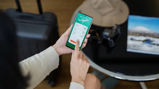 Online Flight Booking on Mobile App stock photo