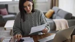 Americans Are Divided on Whether You Can Be Wealthy While in Debt: Here’s What the Experts Say