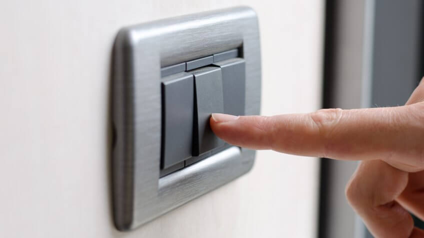 Finger pressing light switch