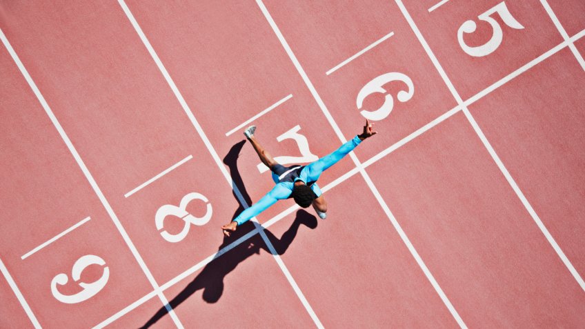 20-24 years, Athlete, Australia, Cheering, Competition, Concentration, Determination, Directly Above, Effort, High Angle View, Motion, Number, On The Move, One Person, One Young Man Only, Running, SPORTS, Shadow, Speed, Sports Race, Sunny, Sydney, Track Event, VICTORY, Winning, Young Adult, achievement, african ethnicity, arms outstretched, color image, copy space, day, energy, finish, finish line, finishing line, full length, horizontal, lane number, man, outdoors, people, photography, racetrack, runner, running track, sprinter, sprinting, success, track & field, winner
