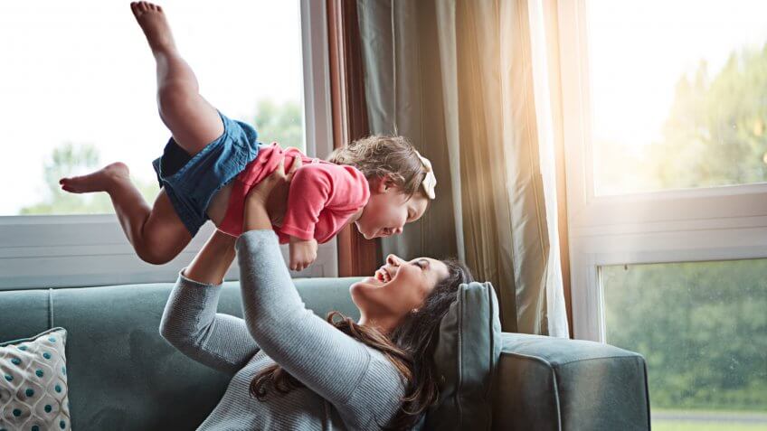 Shot of a mother bonding with her adorable little daughter at home.