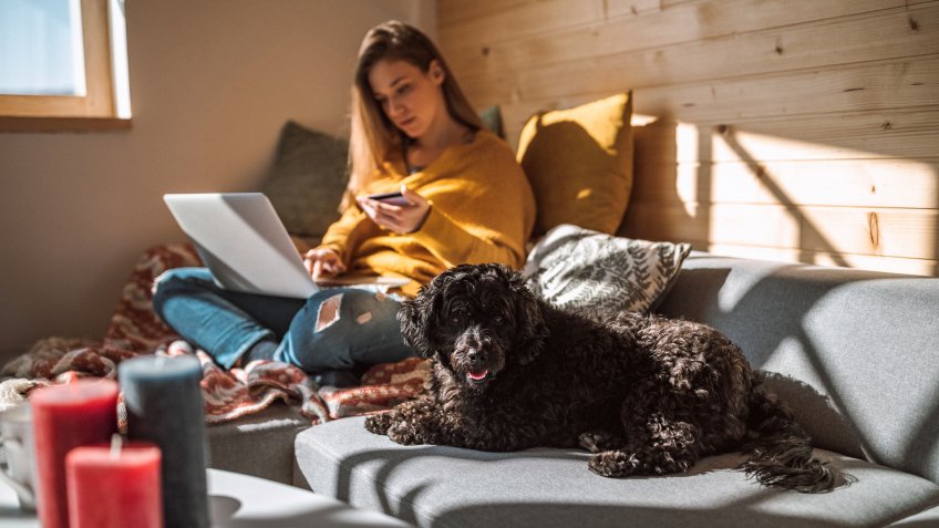 Woman Making Online Purchase Using Her Laptop at Home.