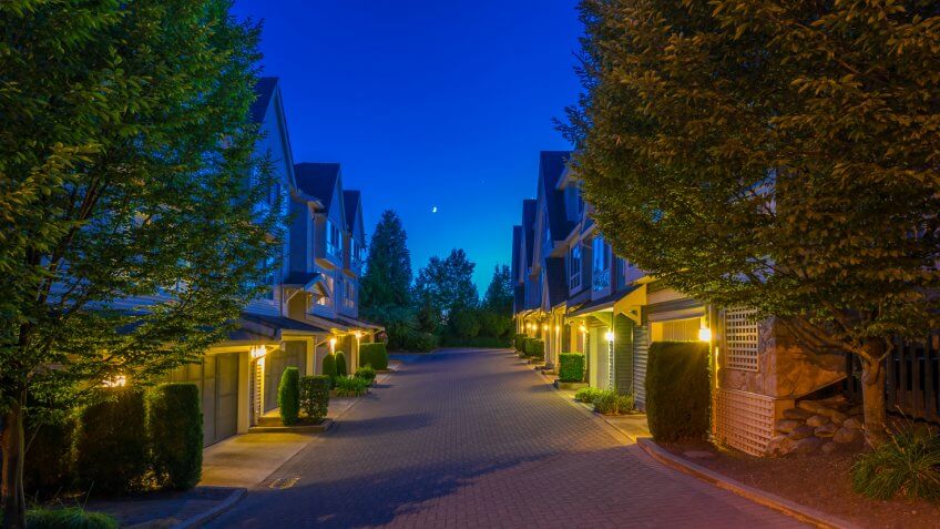 Townhouses, homes, community at dusk, night time in suburbs of Vancouver, Canada.