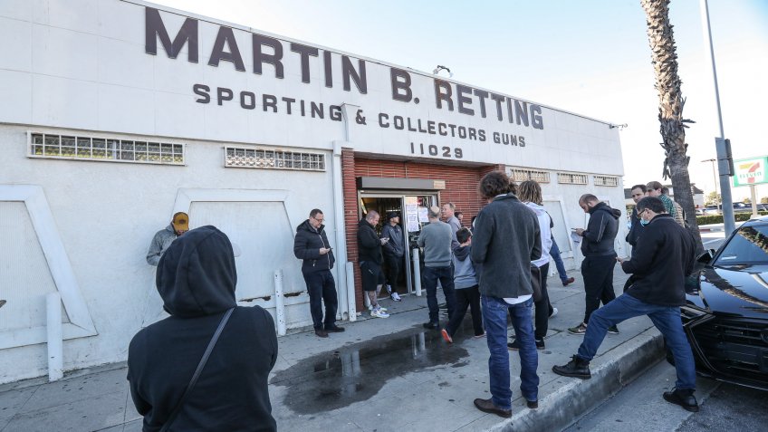 A line is formed outside of a gun store in Culver City in response to the Coronovirus outbreakCoronavirus outbreak, Los Angeles, USA - 17 Mar 2020.