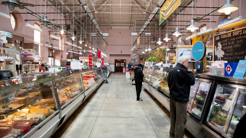 A few customers visit the Eastern Market in Washington, DC, USA, 24 March 2020.
