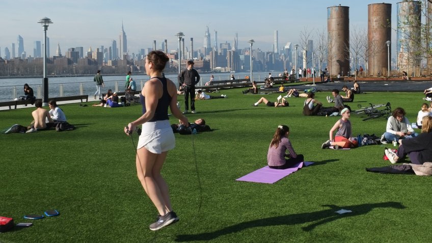 People are seen outside in Domino Park in the Williamsburg section of BrooklynCoronavirus outbreak, New York, USA - 20 Mar 2020.