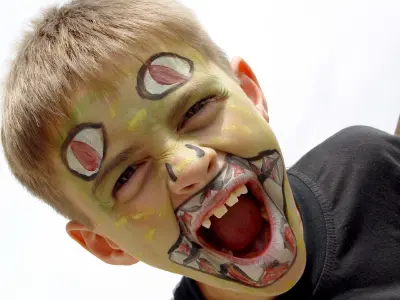 Child with monster facepainting