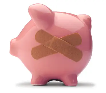 Piggy bank with bandaids on the side